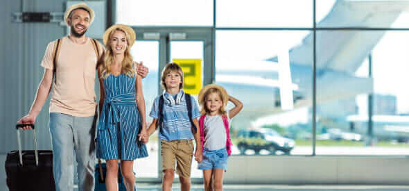 Family arriving at the airport for a quoted before booking car service transfer