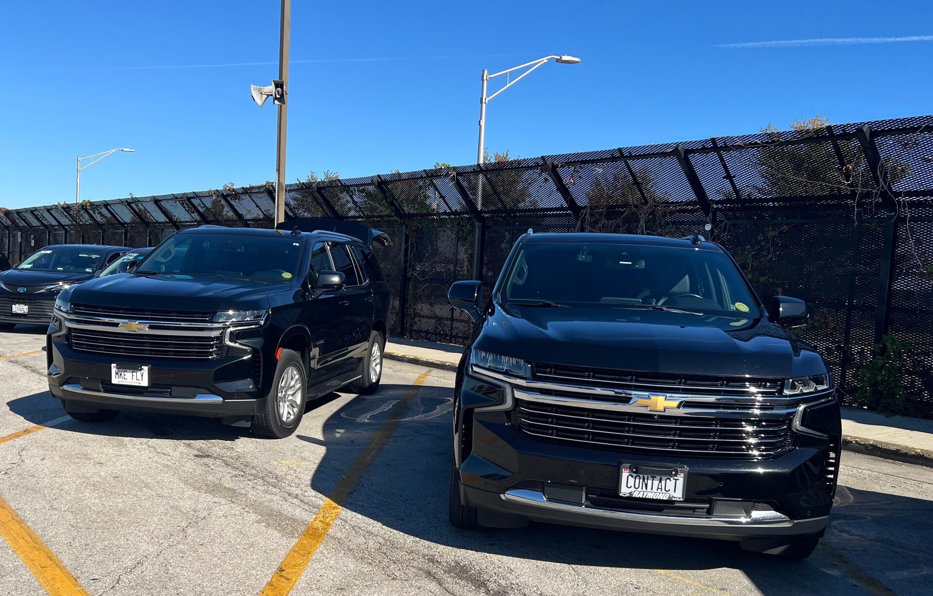 Two Contact Limo luxury SUVs at O'Hare Airport parking area, Kenosha Wisconsin airport limo service