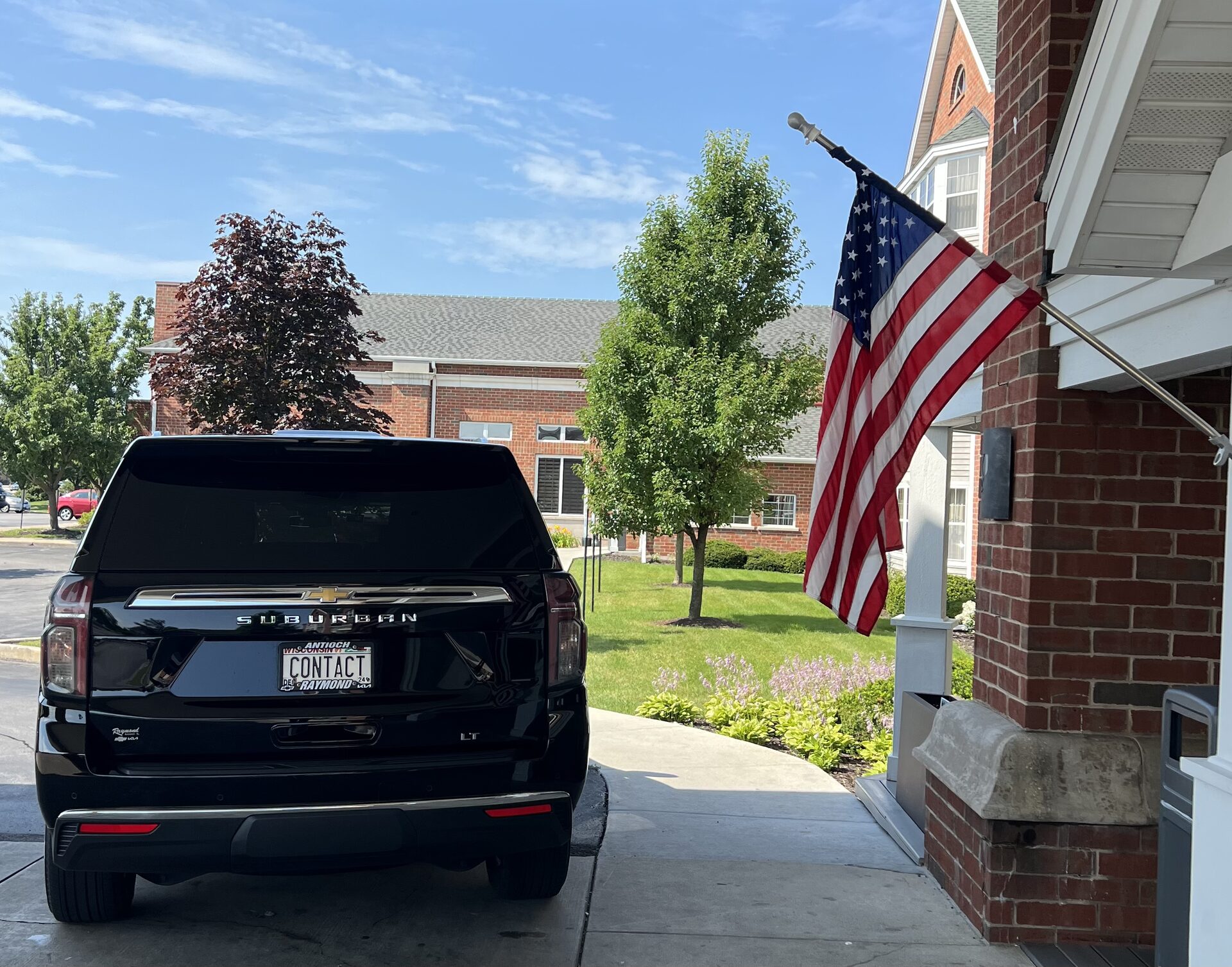 Contact Limo luxury SUV staged for private aviation client — discreet chauffeur service Kenosha