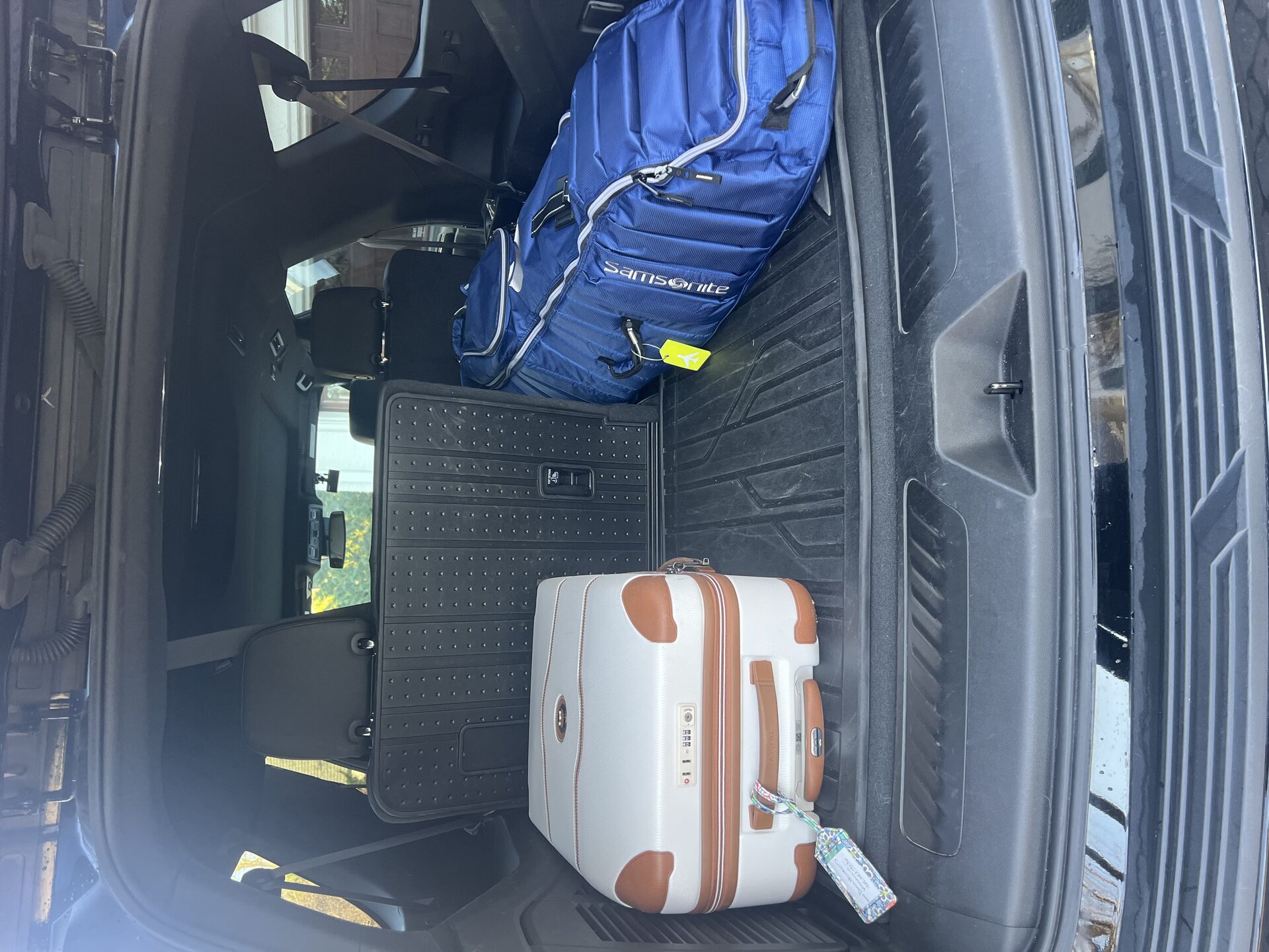 Contact Limo SUV cargo area loaded with luggage for long-distance limo service — generous capacity for extended travel