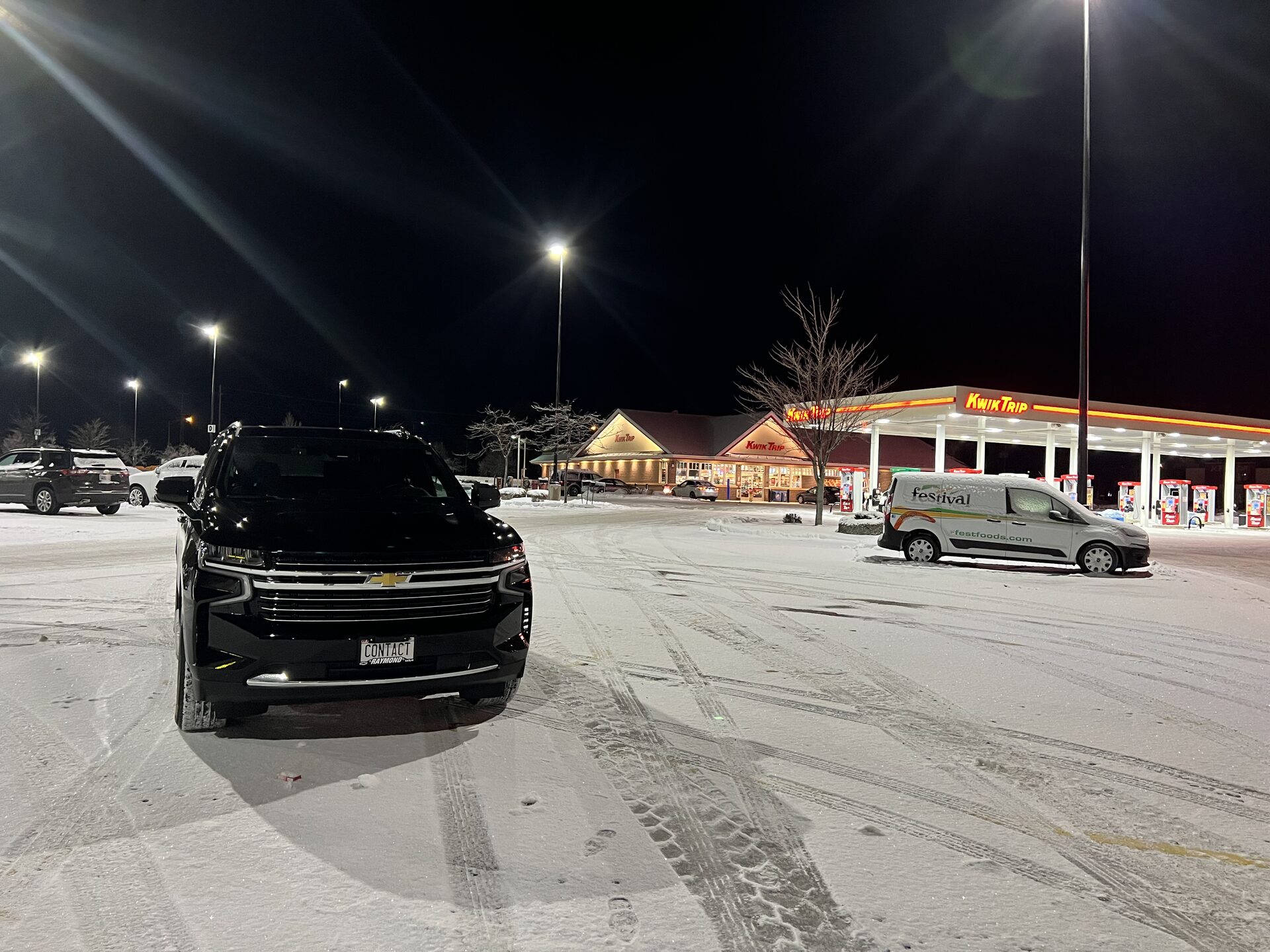 Contact Limo luxury SUV on Wisconsin winter night — 24/7 casino transportation service Kenosha