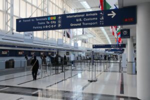 O'Hare International Airport arrivals terminal — ground transport and customs signage